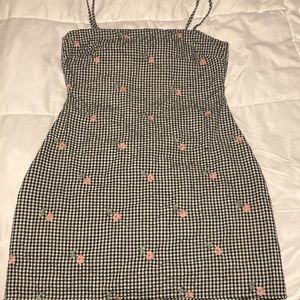 Lulu’s gingham and flower print open back dress.